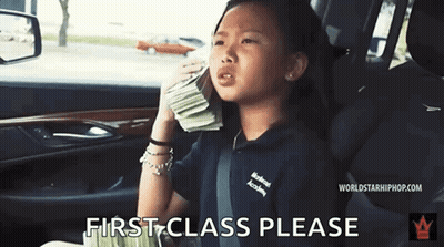 Little Girl In Back Seat Holding Money And Talking On Cell Phone GIF