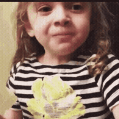 Little Girl In Black And White Striped Shirt Eating Cake GIF