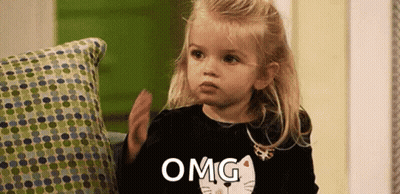 Little Girl in Black Shirt With Cat Says Omg