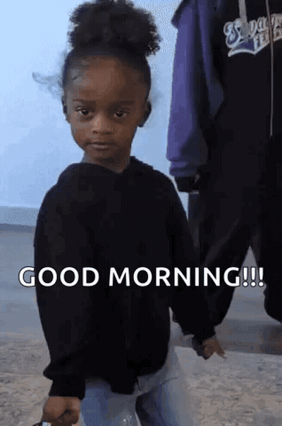 Little Girl In Black Sweater Holding Water Bottle Saying Good Morning GIF