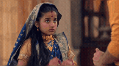 Little Girl In Blue And Gold Costume Holding Man's Hand GIF