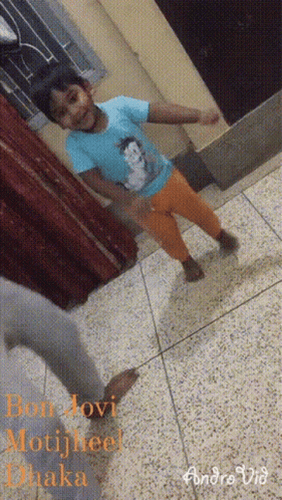Little Girl In Blue Shirt And Orange Pants Dancing GIF