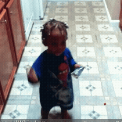 Little Girl In Blue Shirt On Tile Floor GIF