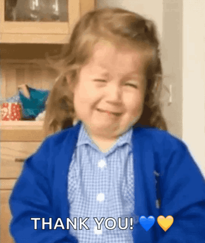 Little Girl In Blue Sweater Smiling And Saying Thank You GIF