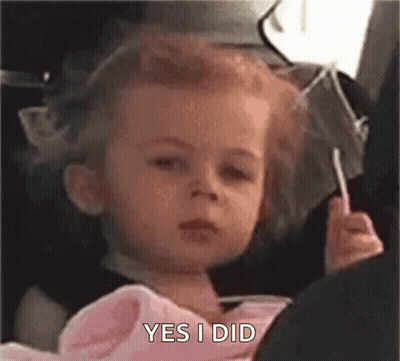 Little Girl In Car Seat With Lollipop Funny Face GIF