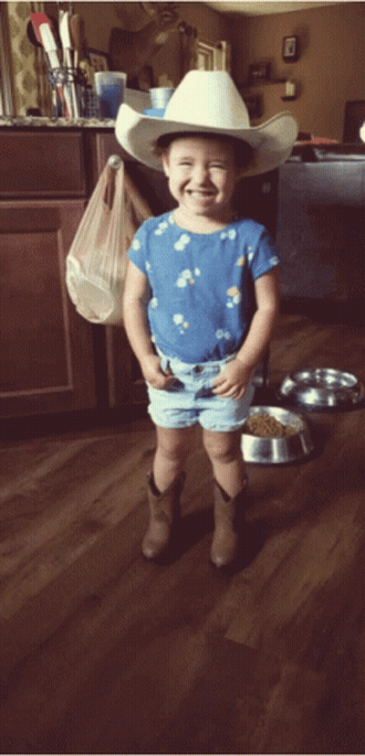 Little Girl In Cowboy Hat And Shorts Smiling GIF