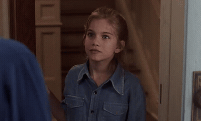 Little Girl In Denim Shirt Saying Sure GIF