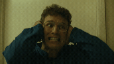 Little Girl In High Chair Fed By Man Saying Yucky GIF