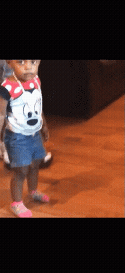 Little Girl In Minnie Mouse Shirt And Denim Shorts GIF