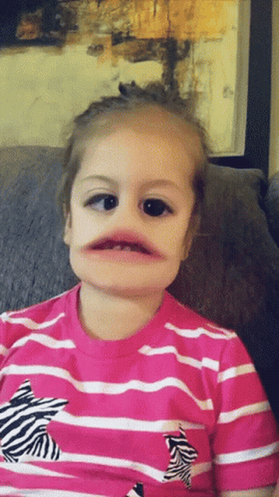 Little Girl In Pink And White Striped Shirt With Zebra GIF