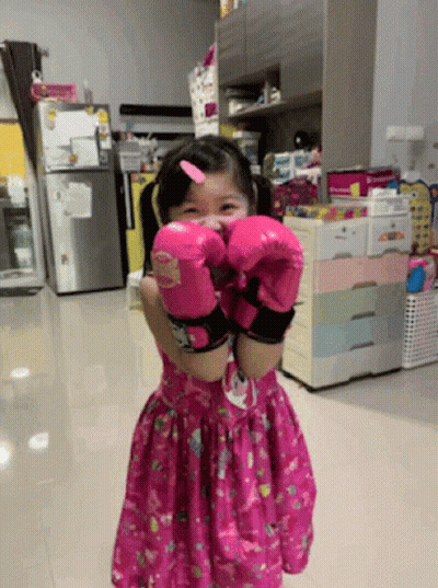 Little Girl In Pink Boxing Gloves GIF