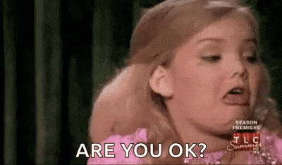 Little Girl In Pink Dress Making Funny Face Asking Are You Ok GIF