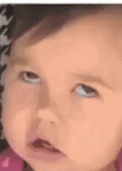 Little Girl In Pink Dress Smiling In Chair GIF