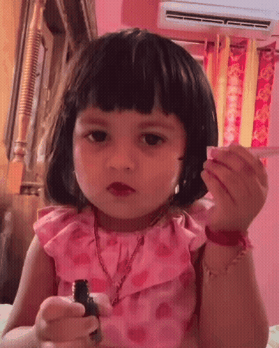 Little Girl In Pink Dress With Lipstick GIF