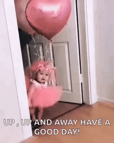 Little Girl In Pink Dress With Pink Balloon In Doorway GIF