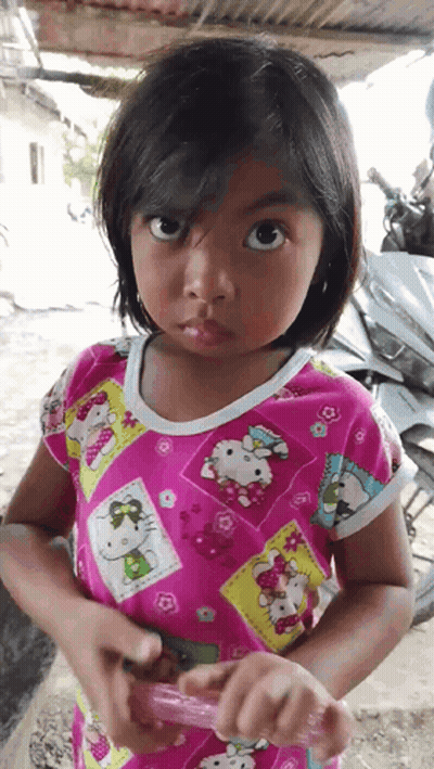 Little Girl in Pink Hello Kitty Shirt