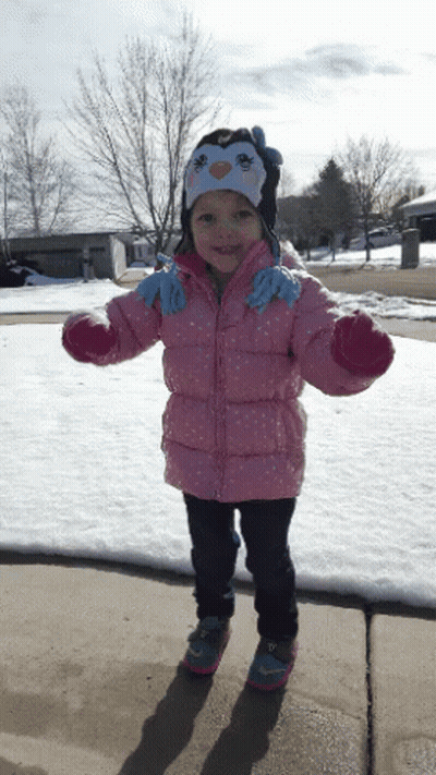 Little Girl In Pink Jacket And Penguin Hat GIF