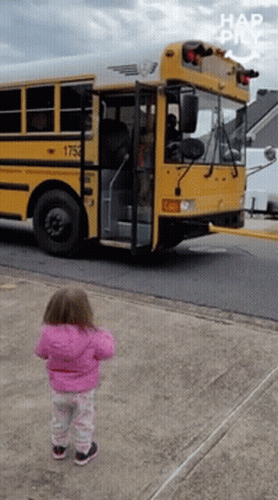 Little Girl in Pink Jacket in Front of School Bus 1753