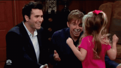 Little Girl In Pink Shirt Hugged By Two Men On NBC GIF