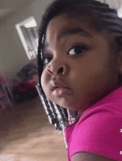 Little Girl In Pink Shirt Making Face GIF