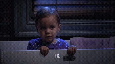 Little Girl In Purple Polka Dot Pajama Saying Hi GIF