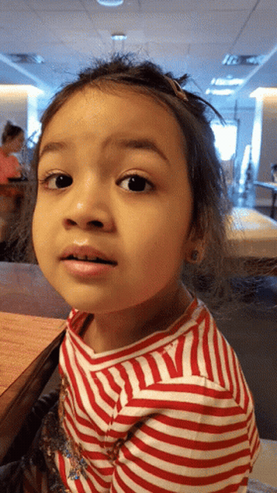 Little Girl In Red And White Striped Shirt Looking GIF
