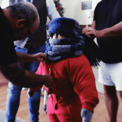 Little Girl In Red Jacket And Blue Scarf GIF
