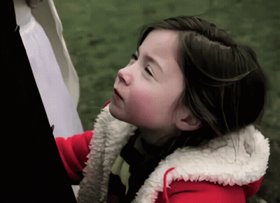 Little Girl In Red Jacket With White Furry Hood GIF