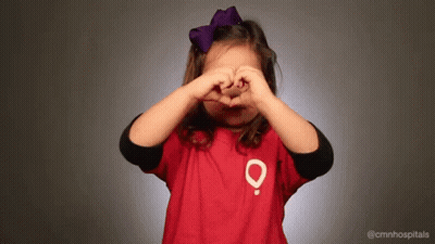 Little Girl In Red Shirt With O Making Heart Hands GIF