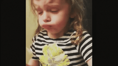 Little Girl In Striped Shirt Making Funny Face GIF