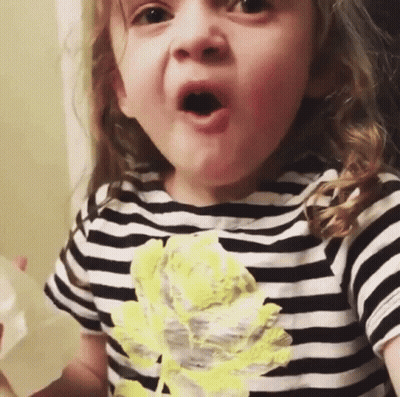 Little Girl In Striped Shirt With Yellow Flower GIF
