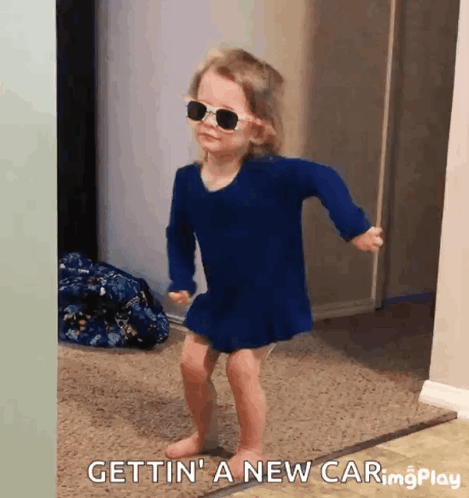 Little Girl In Sunglasses And Blue Dress Dancing GIF