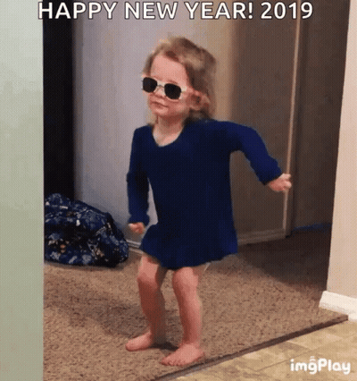 Little Girl In Sunglasses And Blue Dress Dancing With Happy New Year 2019 GIF