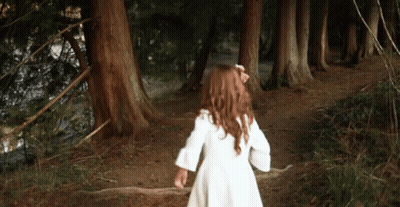 Little Girl In White Dress Running Through Woods GIF