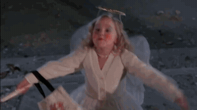Little Girl In White Dress Says Bless You To Halloween Costumes GIF