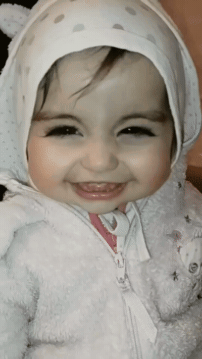 Little Girl In White Hat And Jacket Smiling GIF
