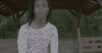 Little Girl In White Shirt Dancing In Front Of Gazebo GIF