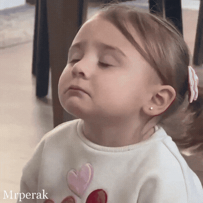 Little Girl In White Shirt With Hearts GIF