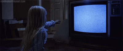 Little Girl Looking At TV With Ghost GIF