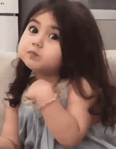Little Girl Making Funny Face And Pointing GIF