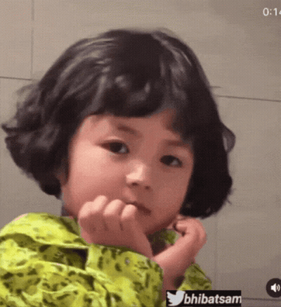 Little Girl Making Funny Face With Hand On Chin GIF