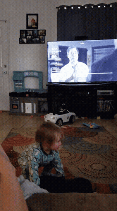 Little Girl On Couch Watching Fox News GIF