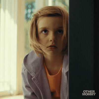 Little Girl Peeking From Behind Wall GIF