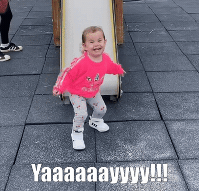 Little Girl Playing On Slide GIF