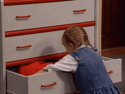 Little Girl Reaching Into Dresser Drawer GIF