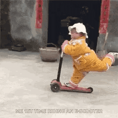 Little Girl Riding E-Scooter GIF