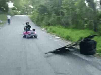 Little Girl Riding Pink Toy Jeep GIF