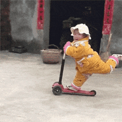 Little Girl Riding Scooter GIF