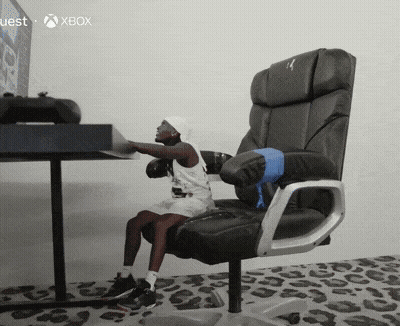 Little Girl Sitting In Chair In Front Of Xbox Monitor GIF