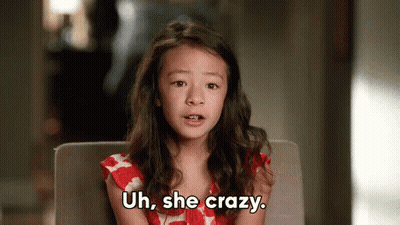 Little Girl Sitting In Chair Saying Uh She Crazy GIF
